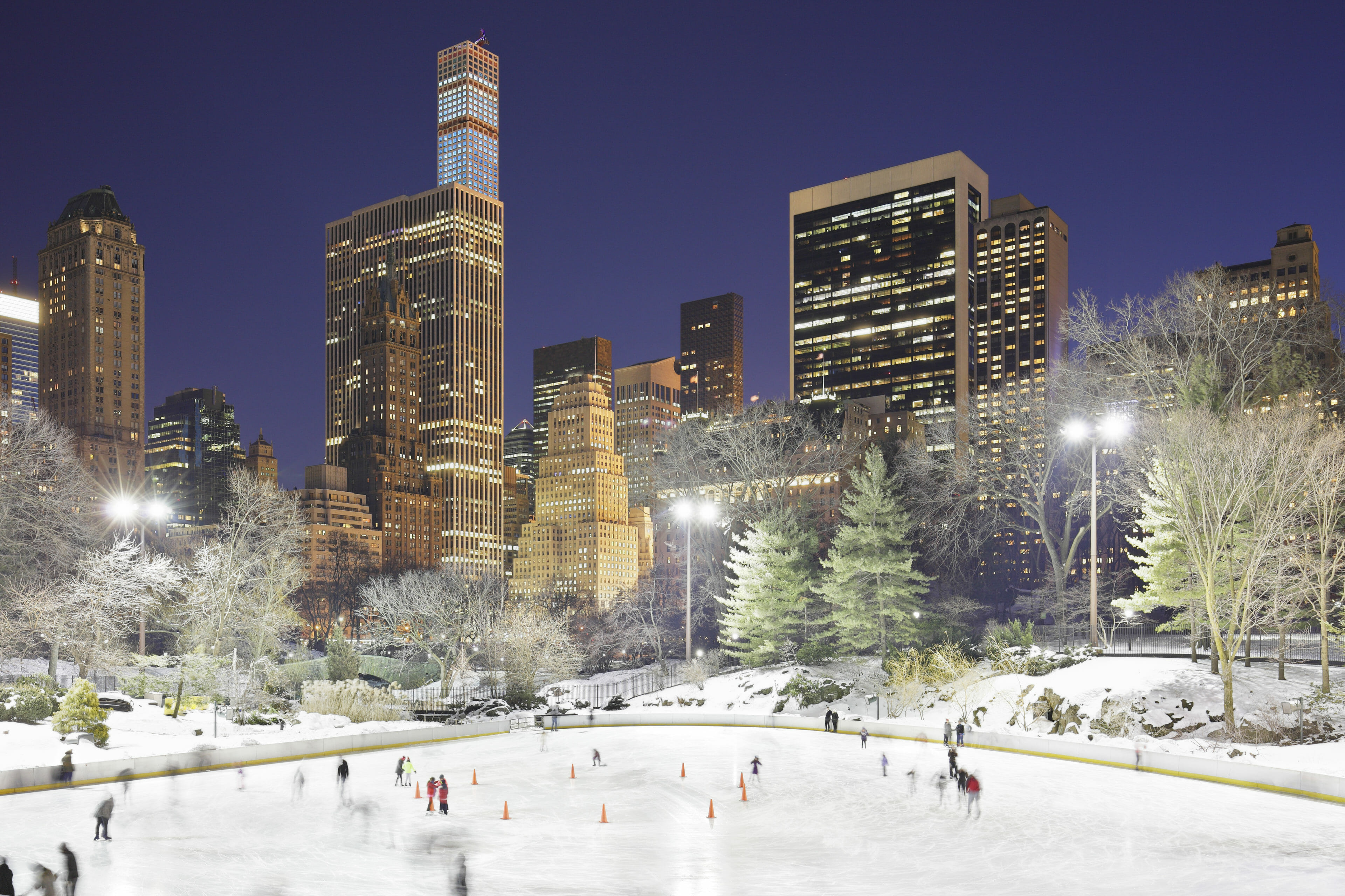 Ice skating in Central Park has been a tradition for residents and tourists alike. At its opening (1858) and for the next century the Central Park Lake was filled with ice skaters. The lake was closed to skaters when Wollman Rink opened in 1950 putting skaters beneath the city skyline.